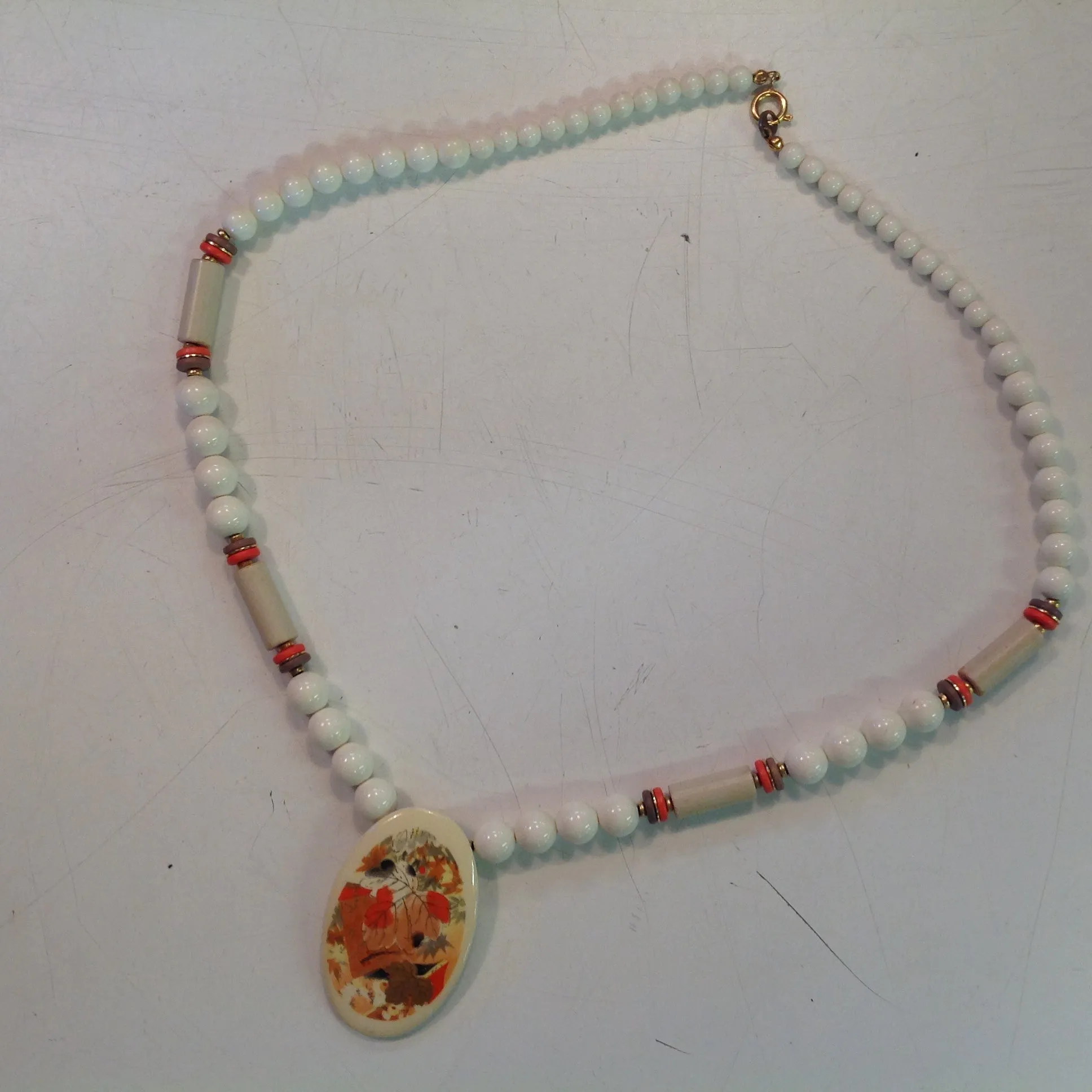 Vintage White Plastic Beaded Necklace with Enamel Autumn Foliage Pendant