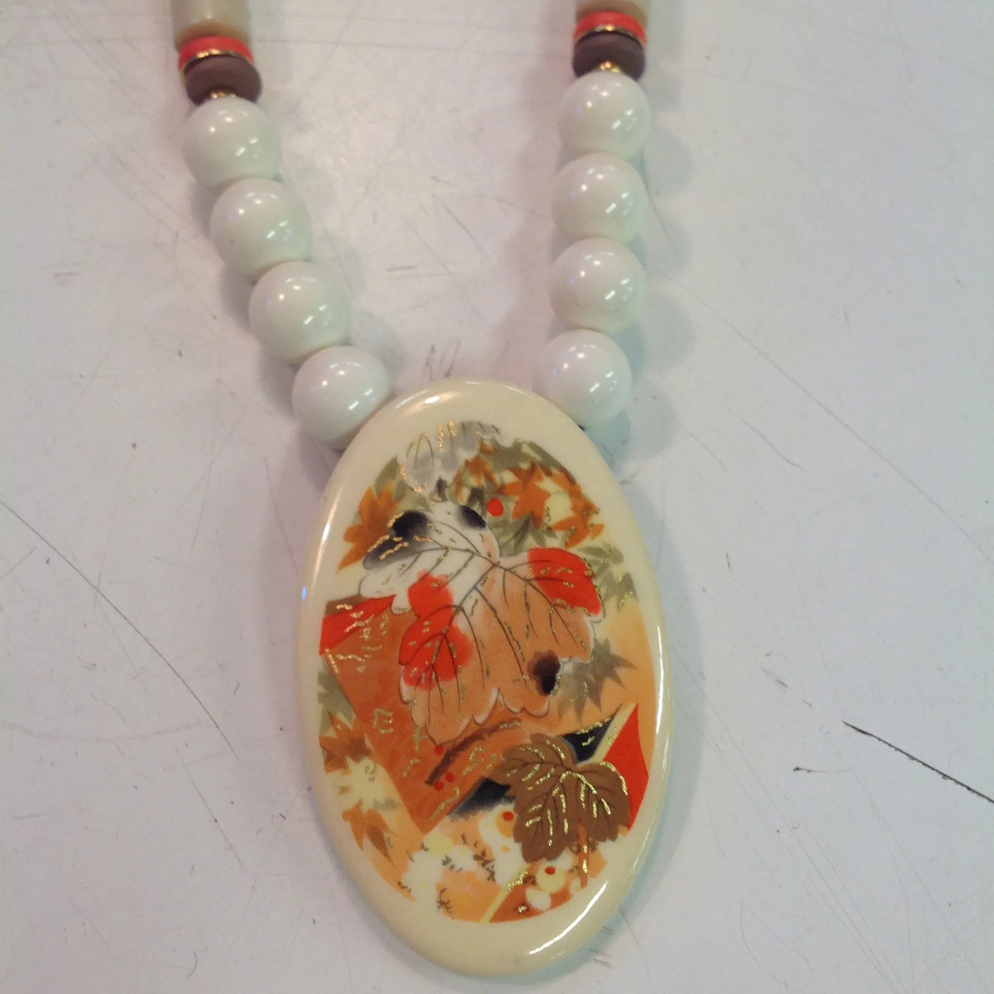 Vintage White Plastic Beaded Necklace with Enamel Autumn Foliage Pendant
